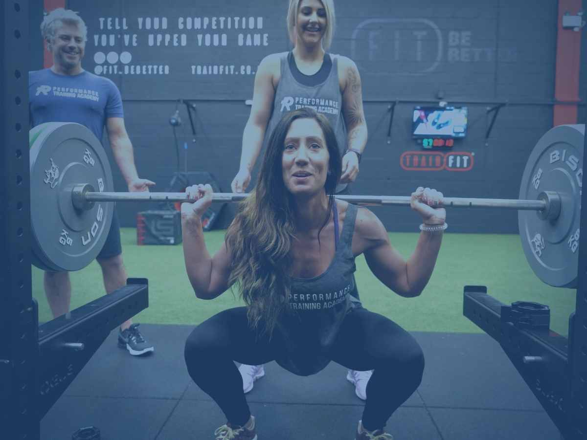 gym-and-pt-homepage-image performance training academy students learning how to correctly squat